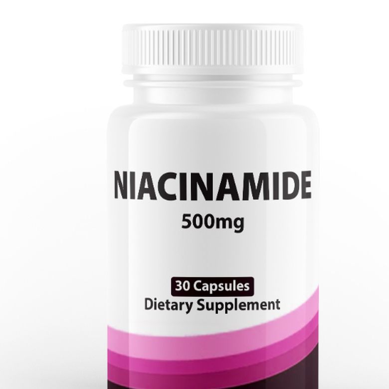 White bottle labelled Niacinamide 500 mg, 30 capsules, dietary supplement, with a pink band